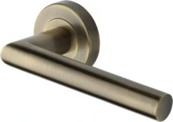 Athena Lever Handle On Round Rose - Antique Brass (Gloss Lacquered)