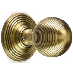 Queen Anne Style Reeded Pattern Door Knobs - Antique Brass (Lacquered)