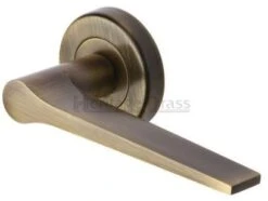 Gio Lever On Round Rose Lever Handles - Antique Brass (Gloss Lacquered)